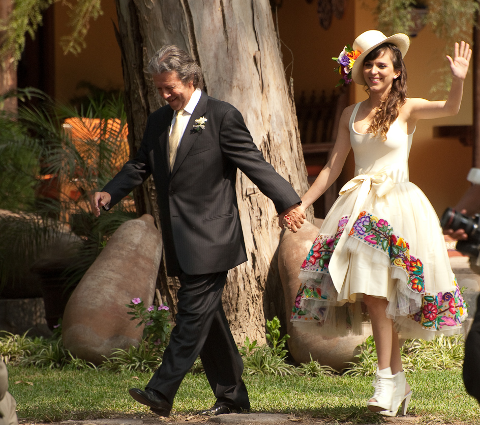 Bride waving away at her wedding day 