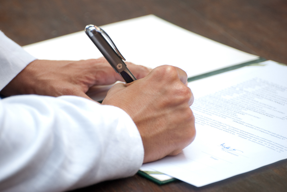 signing the wedding papers