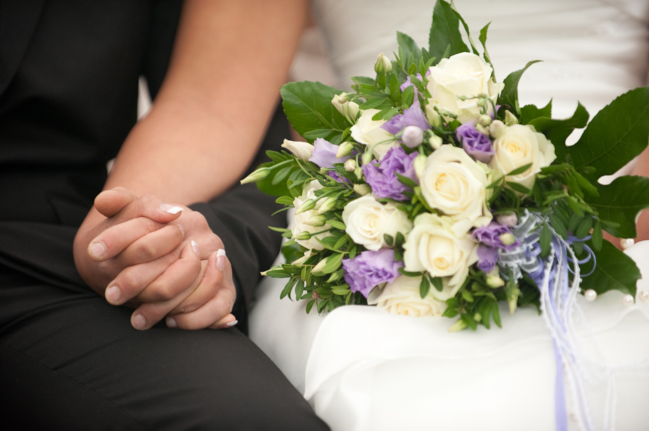 Bride and Groom Hold Hands